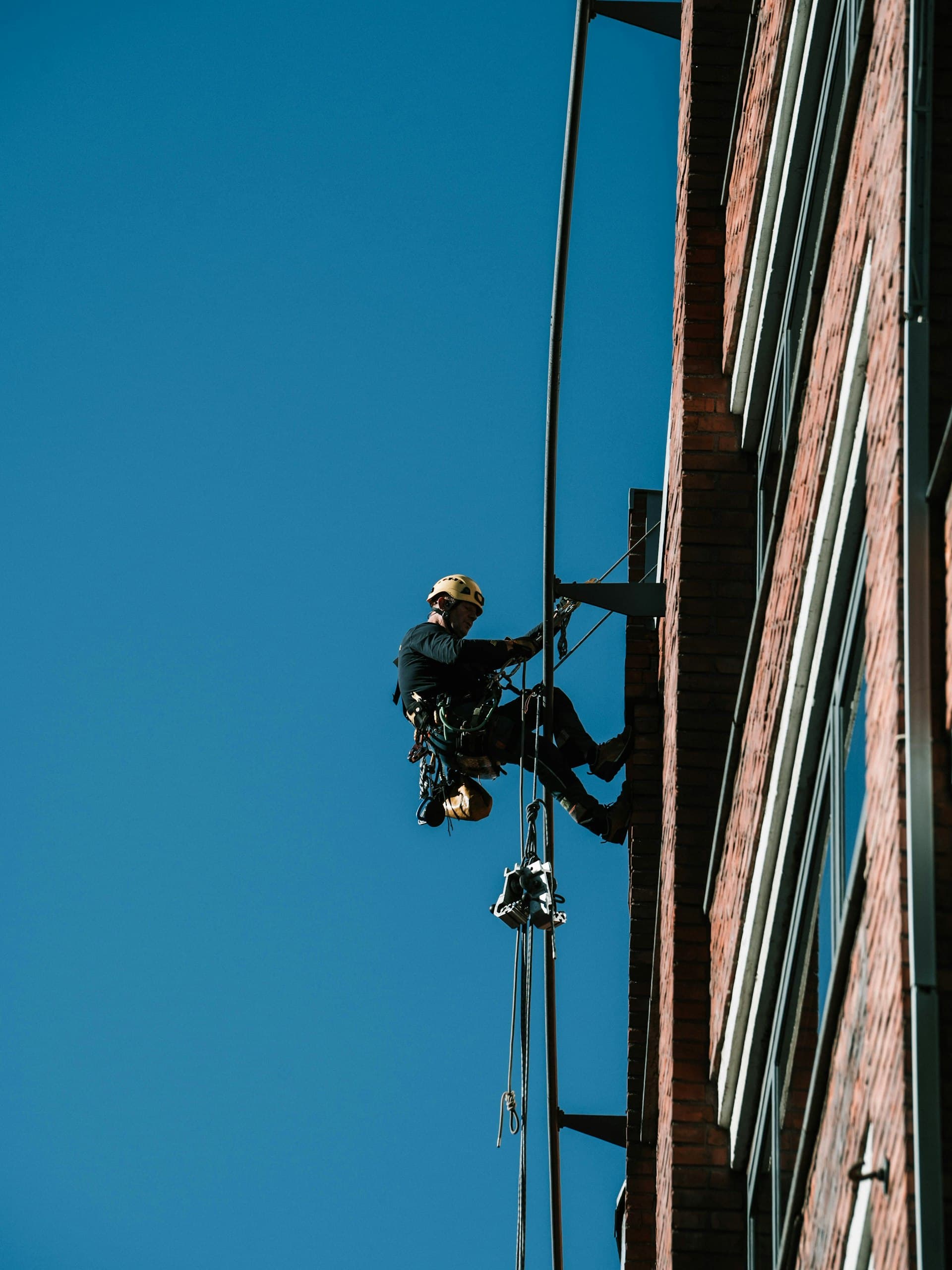 Rope access technician working at height